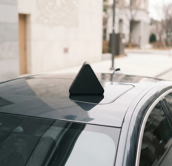 A black CortegeBlox block on a vehicle in a cortège